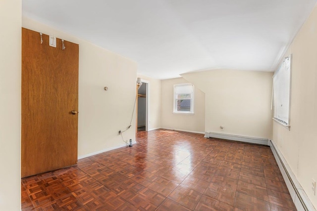 17 Linn Pl, Yonkers, NY 10705 - empty room with baseboard heating, a baseboard heating unit, lofted ceiling, and baseboards
