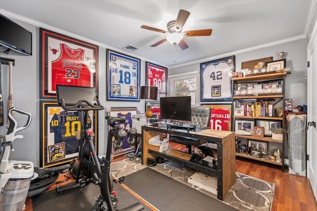 105 Shoreham Way, Merrick, NY 11566 - workout area with ornamental molding, ceiling fan, and wood finished floors