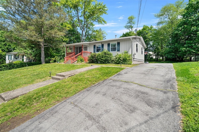 69 Wickham Dr, Warwick, NY 10990 - single story home featuring covered porch, a front yard, and asphalt driveway