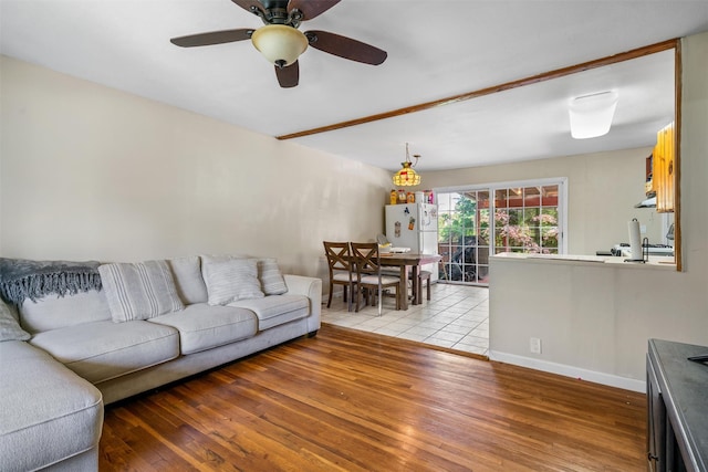 69 Wickham Dr, Warwick, NY 10990 - living area with light wood-style floors, a ceiling fan, and baseboards