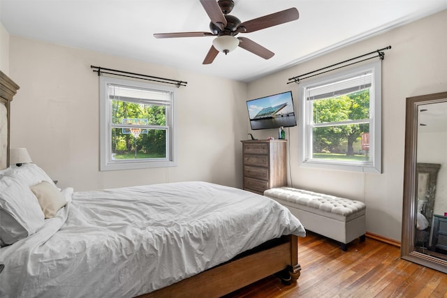 69 Wickham Dr, Warwick, NY 10990 - bedroom with multiple windows, wood-type flooring, a ceiling fan, and baseboards