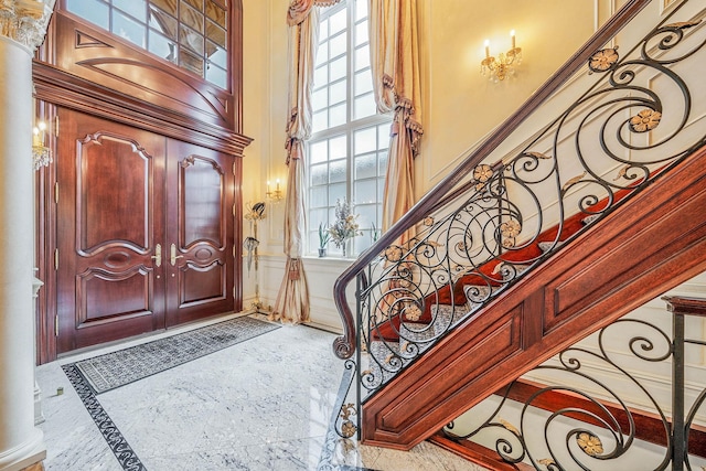 16136 90th St, Howard Beach, NY 11414 - foyer with inlaid floor details, a high ceiling, and stairway