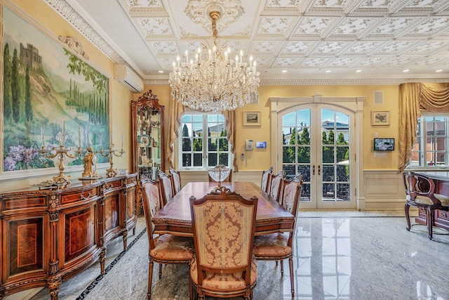 16136 90th St, Howard Beach, NY 11414 - dining room with french doors, plenty of natural light, a chandelier, a wainscoted wall, and a decorative wall