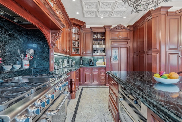 16136 90th St, Howard Beach, NY 11414 - kitchen featuring inlaid floor details, appliances with stainless steel finishes, recessed lighting, tasteful backsplash, and dark stone countertops
