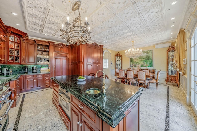 16136 90th St, Howard Beach, NY 11414 - kitchen featuring inlaid floor details, a chandelier, an ornate ceiling, ornamental molding, and recessed lighting