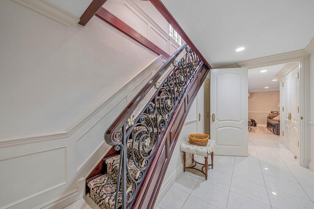16136 90th St, Howard Beach, NY 11414 - stairway featuring tile patterned floors, ornamental molding, a decorative wall, recessed lighting, and baseboards