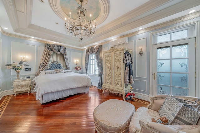 16136 90th St, Howard Beach, NY 11414 - bedroom with a decorative wall, a wall mounted air conditioner, crown molding, a chandelier, and wood finished floors