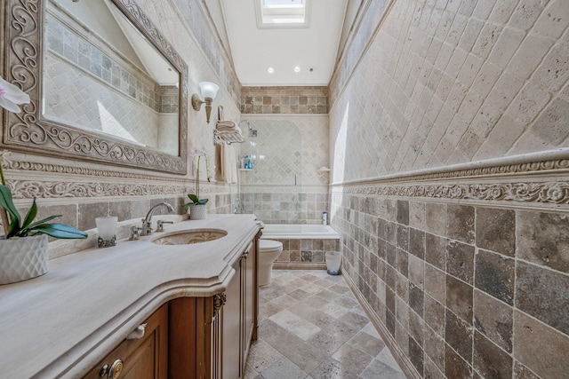16136 90th St, Howard Beach, NY 11414 - full bathroom with tile walls, toilet, stone tile flooring, vanity, and tiled shower / bath