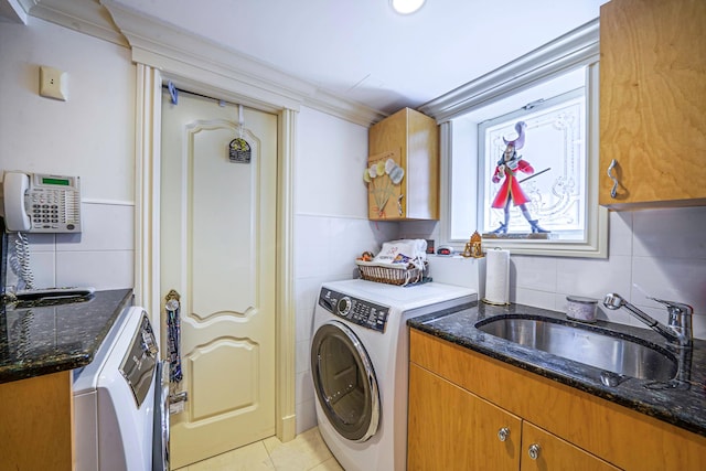 16136 90th St, Howard Beach, NY 11414 - laundry area with cabinet space, washer / dryer, tile walls, and light tile patterned floors