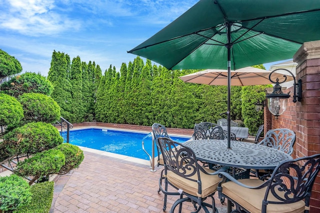 16136 90th St, Howard Beach, NY 11414 - outdoor pool featuring a patio and outdoor dining area