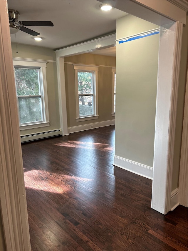 11 Fox Holw, Hillburn, NY 10931 - spare room with baseboard heating, ceiling fan, plenty of natural light, and dark wood finished floors