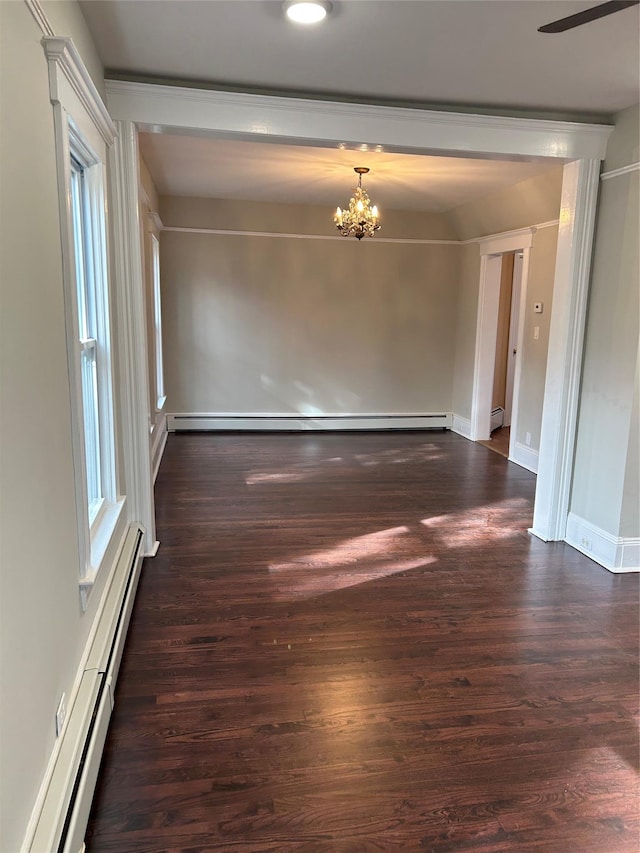 11 Fox Holw, Hillburn, NY 10931 - spare room with a baseboard radiator, a chandelier, dark wood finished floors, and ceiling fan