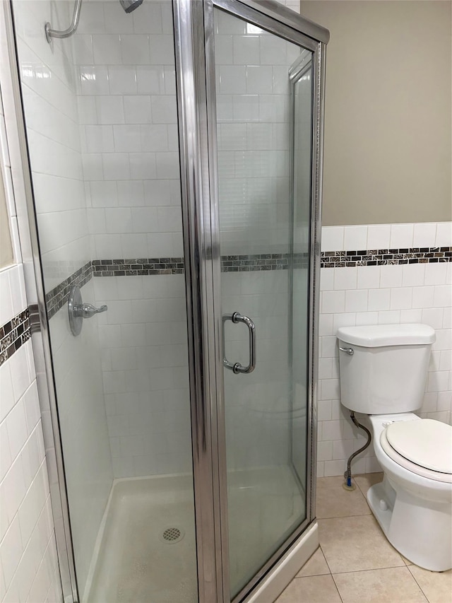 11 Fox Holw, Hillburn, NY 10931 - bathroom with tile walls, a shower stall, tile patterned floors, and a wainscoted wall