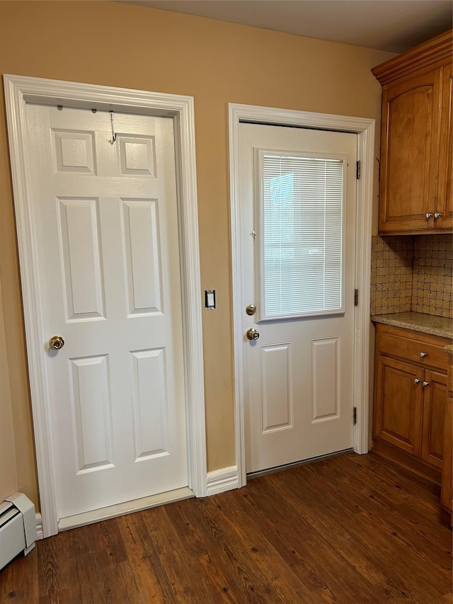 11 Fox Holw, Hillburn, NY 10931 - entryway featuring baseboard heating and dark wood-type flooring