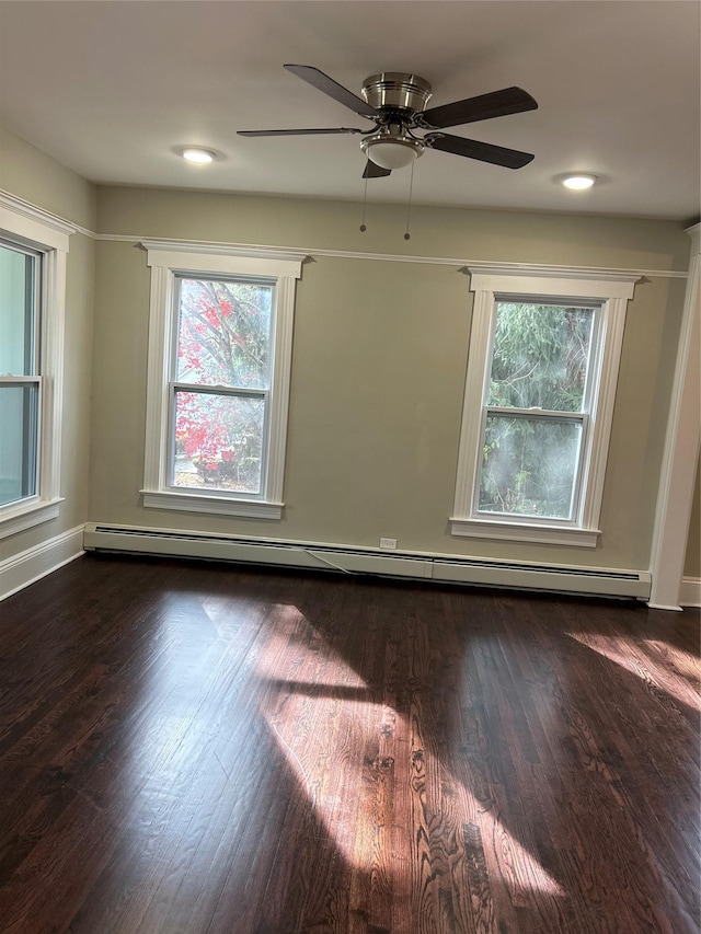 11 Fox Holw, Hillburn, NY 10931 - empty room with a baseboard radiator, plenty of natural light, dark wood-style floors, and ceiling fan