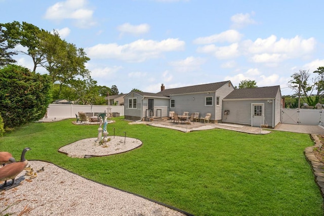 220 Farhan Ln, North Babylon, NY 11703 - back of house with a gate, a patio area, and a chimney