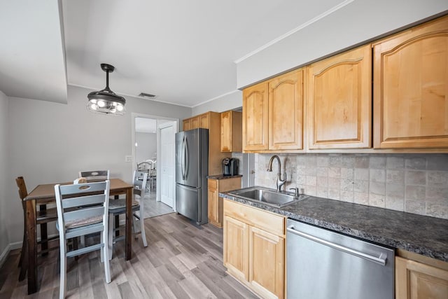 220 Farhan Ln, North Babylon, NY 11703 - kitchen with stainless steel appliances, a sink, backsplash, dark countertops, and crown molding