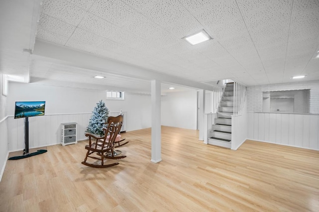 220 Farhan Ln, North Babylon, NY 11703 - basement with wood finished floors, stairs, and wainscoting