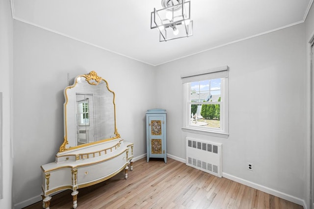 220 Farhan Ln, North Babylon, NY 11703 - bedroom with radiator heating unit, wood finished floors, ornamental molding, and baseboards