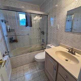 220 Farhan Ln, North Babylon, NY 11703 - bathroom with ornamental molding, tiled shower / bath, tile walls, vanity, and tile patterned floors