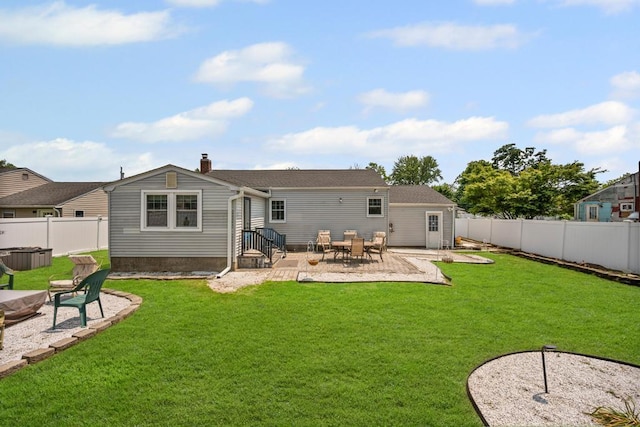 220 Farhan Ln, North Babylon, NY 11703 - rear view of property with a fenced backyard, a patio area, a jacuzzi, and a chimney