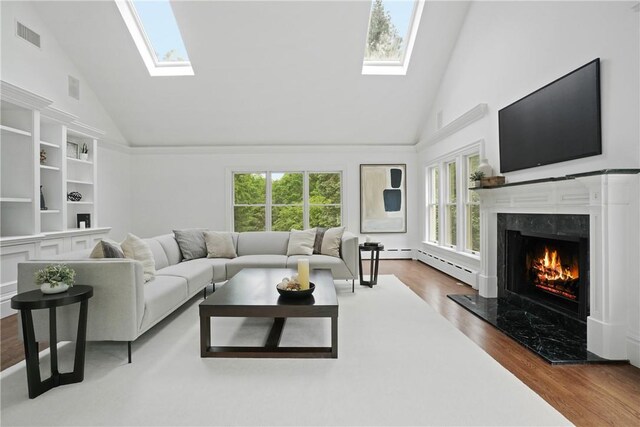 792-820 Old Post Rd, Bedford, NY 10506 - living area featuring a skylight, high vaulted ceiling, plenty of natural light, and a fireplace
