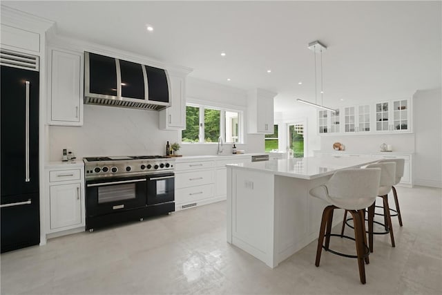792-820 Old Post Rd, Bedford, NY 10506 - kitchen featuring high end appliances, white cabinets, and recessed lighting