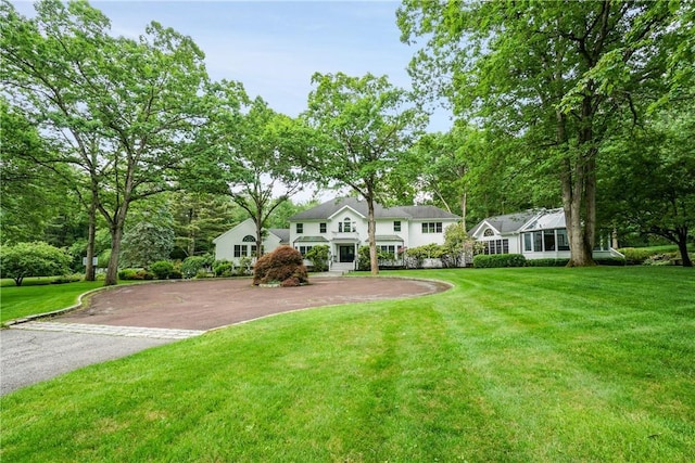 792-820 Old Post Rd, Bedford, NY 10506 - traditional home with asphalt driveway and a front yard