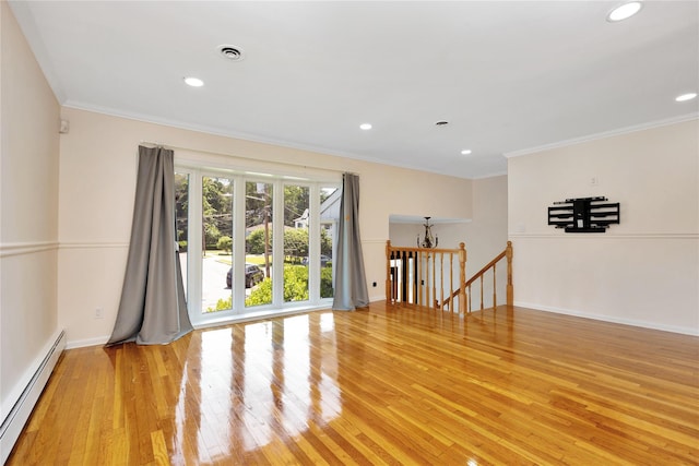 446 Joan Ct, West Hempstead, NY 11552 - unfurnished room featuring a baseboard heating unit, light wood-style floors, crown molding, and recessed lighting