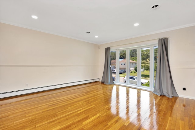 446 Joan Ct, West Hempstead, NY 11552 - empty room featuring baseboard heating, crown molding, light wood-style floors, and recessed lighting