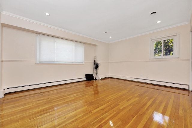 446 Joan Ct, West Hempstead, NY 11552 - empty room with a baseboard heating unit, light wood-style floors, crown molding, and recessed lighting
