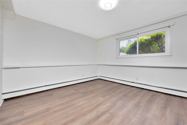 446 Joan Ct, West Hempstead, NY 11552 - unfurnished room featuring wood finished floors and baseboard heating