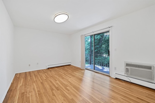 12 Normandy Vlg Unit 2, Nanuet, NY 10954 - spare room with baseboard heating, light wood finished floors, a baseboard heating unit, and baseboards