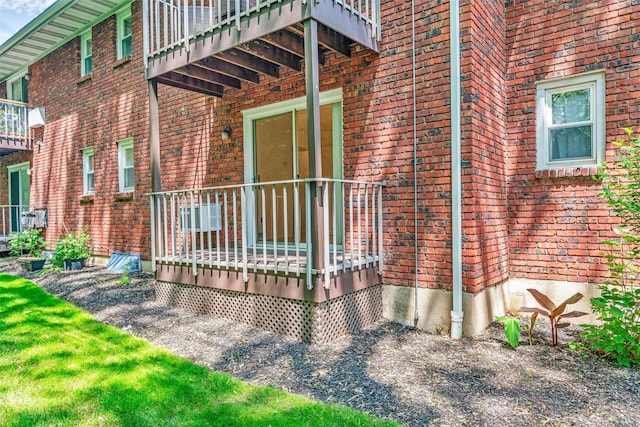 12 Normandy Vlg Unit 2, Nanuet, NY 10954 - view of property exterior with a wooden deck and brick siding
