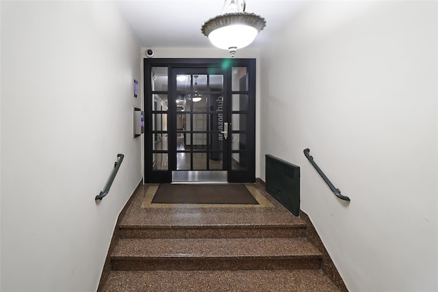 2105 Wallace Ave Unit 4A, Bronx, NY 10462 - stairway featuring french doors and baseboards