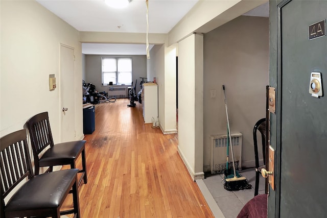 2105 Wallace Ave Unit 4A, Bronx, NY 10462 - hall featuring light wood-type flooring, radiator heating unit, and a desk