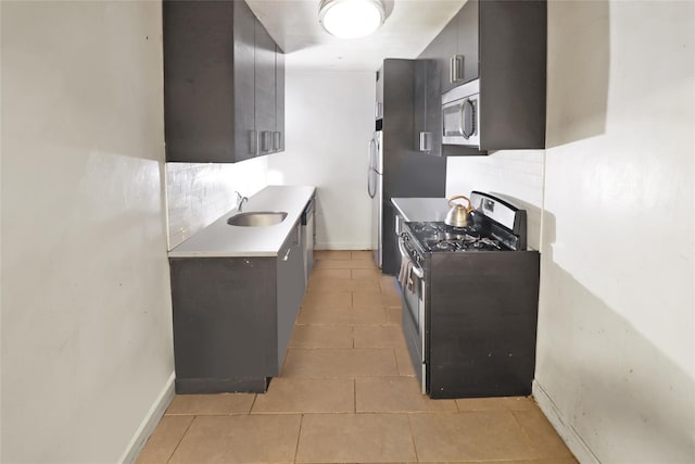 2105 Wallace Ave Unit 4A, Bronx, NY 10462 - kitchen featuring stainless steel appliances, decorative backsplash, light tile patterned flooring, and light countertops