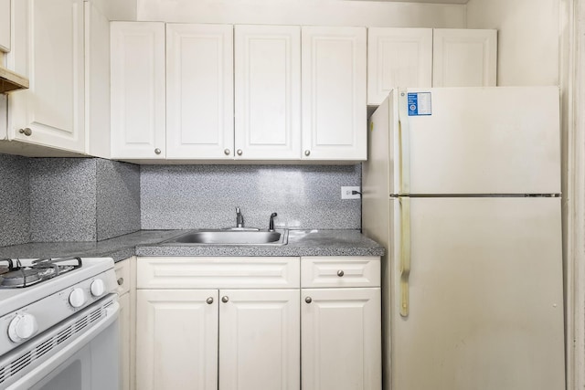61-15 97th St Unit 8M, Rego Park, NY 11374 - kitchen with white appliances, white cabinets, a sink, and dark countertops
