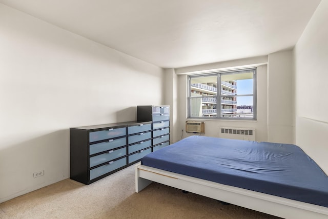 61-15 97th St Unit 8M, Rego Park, NY 11374 - carpeted bedroom featuring radiator heating unit