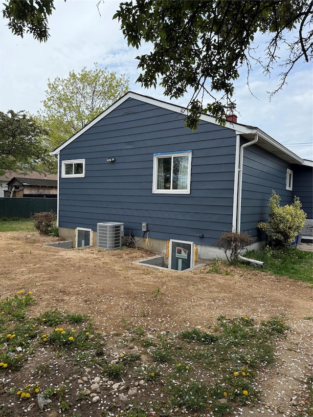 1251 Udall Rd, Bay Shore, NY 11706 - rear view of house featuring central AC