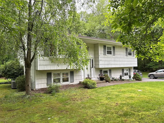 7 S Van Dyke Ave, Airmont, NY 10901 - view of front of home with a front lawn and cooling unit