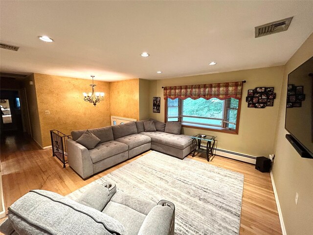 7 S Van Dyke Ave, Airmont, NY 10901 - living area featuring a chandelier, wood finished floors, recessed lighting, baseboards, and a baseboard radiator