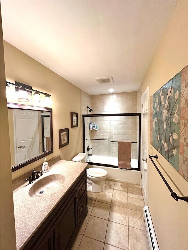 7 S Van Dyke Ave, Airmont, NY 10901 - bathroom featuring toilet, vanity, baseboard heating, bath / shower combo with glass door, and tile patterned floors