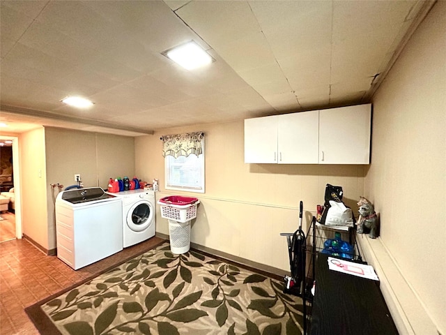 7 S Van Dyke Ave, Airmont, NY 10901 - laundry room featuring washer and clothes dryer, cabinet space, tile patterned floors, and baseboards