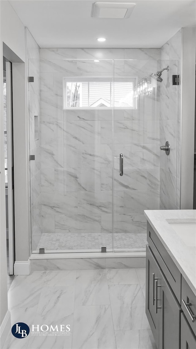 16 Stephens Ln, Valhalla, NY 10595 - full bath featuring a marble finish shower, vanity, marble finish flooring, recessed lighting, and baseboards