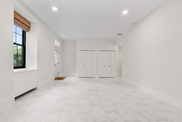 341 Furnace Dock Rd Unit 30, Cortlandt Manor, NY 10567 - unfurnished bedroom featuring multiple closets, light marble finish flooring, and recessed lighting