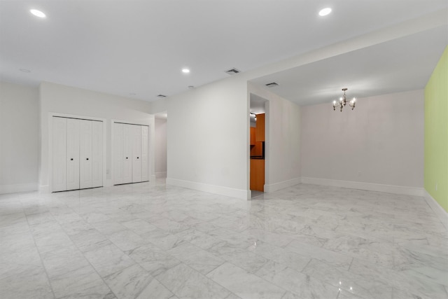 341 Furnace Dock Rd Unit 30, Cortlandt Manor, NY 10567 - empty room with light marble finish floors, a chandelier, and recessed lighting