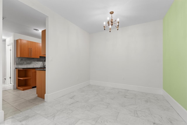 341 Furnace Dock Rd Unit 30, Cortlandt Manor, NY 10567 - unfurnished dining area featuring a chandelier and light marble finish floors