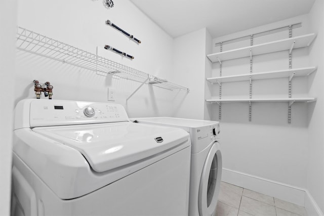 341 Furnace Dock Rd Unit 30, Cortlandt Manor, NY 10567 - laundry area featuring independent washer and dryer and light tile patterned flooring