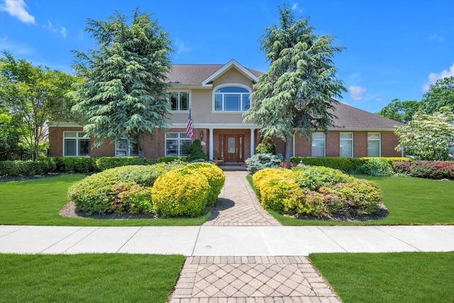 251 Wilmot Dr, Hewlett, NY 11557 - view of front of home featuring a front lawn and brick siding